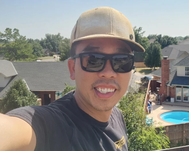 man wearing cap and shades selfie